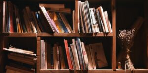 books on brown wooden shelf